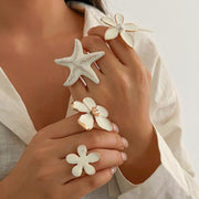 Personalized drip oil five petal flower three-dimensional ring with exaggerated metallic feel, starfish pearl ring